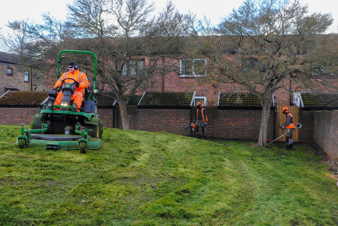 Image of HTS grass cutting team in action 