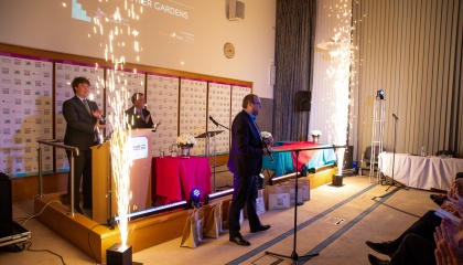 Image of person ready to present an award at the Town Centre Awards