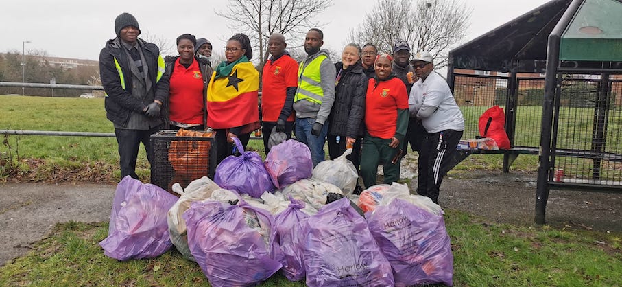 Group of people from Ghana Union with litter bags