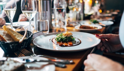 Image of food and drink and cutlery on a table 