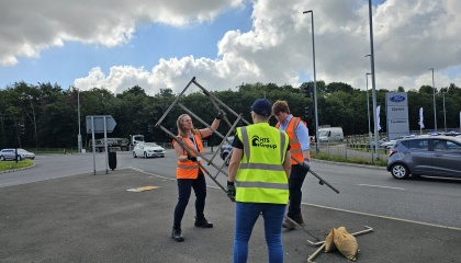 HTS staff with cllrs Swords and Purse clearing away an old signage frame
