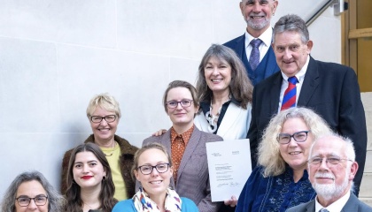 Image of Museum staff and volunteers celebrating the award