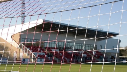 Image of main stand at Harlow Town Football Club looking from one of the goal nets