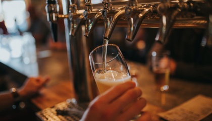 Image of glass of beer being pulled from a pump