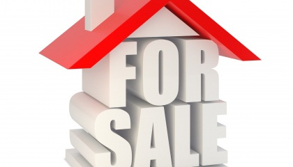 Image of roof of house and chimney with the words for sale underneath 