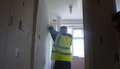 Image of operative working inside a home 