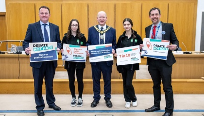 Image of adult and youth councillors with Debate Not Hate holding posters 