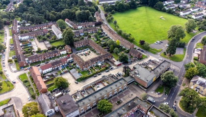 Aerial image of The Stow area of Harlow showing homes, shopping centre and business areas 