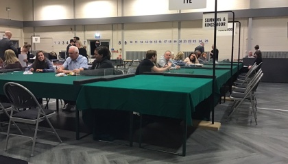 Picture taken on the night of the election count showing the counting table and election counters waiting to start