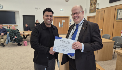 Councillor Hardware with one of the recipients from the first round of Digital Boost Grant funding