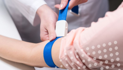 Nurse preparing to take blood of patient