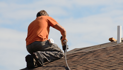 Man fixing roof