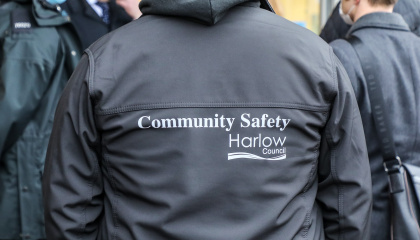 Image of the back of a Community Safety officer with the words Community Safety
