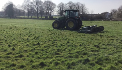 Image of tractor cutting grass in Harlow 